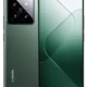Front and back view of a green Xiaomi smartphone, featuring a quad-camera module in the top-left rear and a punch-hole front camera.