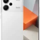 White Redmi smartphone shown from back and front, highlighting a triple-camera module and rear logo.