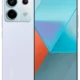 Light purple Redmi smartphone shown from back and front; large rectangular camera module with three lenses and a flash, curved edges.