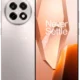 Back and front view of a silver OnePlus smartphone: quad-camera circle on the back and a tall-edge display showing a peach wallpaper with 'Never Settle' text.