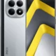 Poco smartphone with a silver back showing a quad-camera array and an edge-to-edge display with yellow geometric wallpaper on the screen.